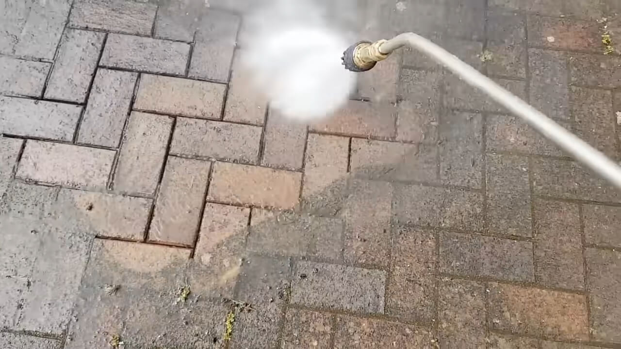 Use a pressure washer for deep cleaning bricks